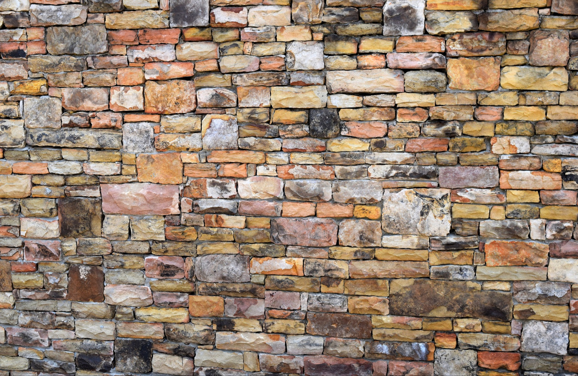 stacked stone wall with multi-colored rocks